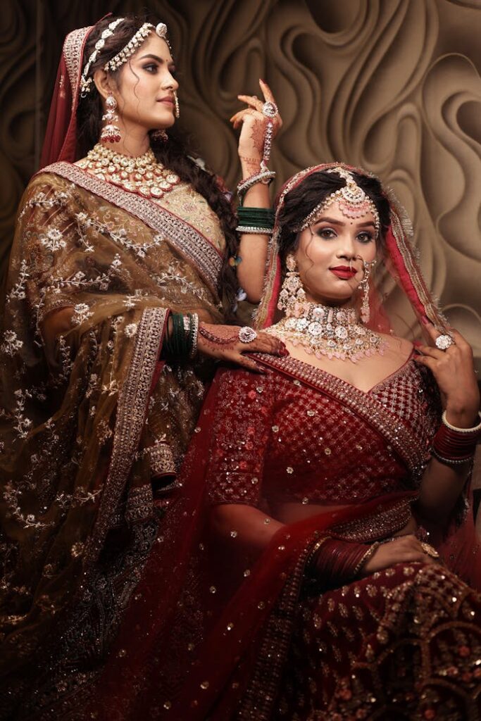 Two Young Women Posing in Ornate Clothing