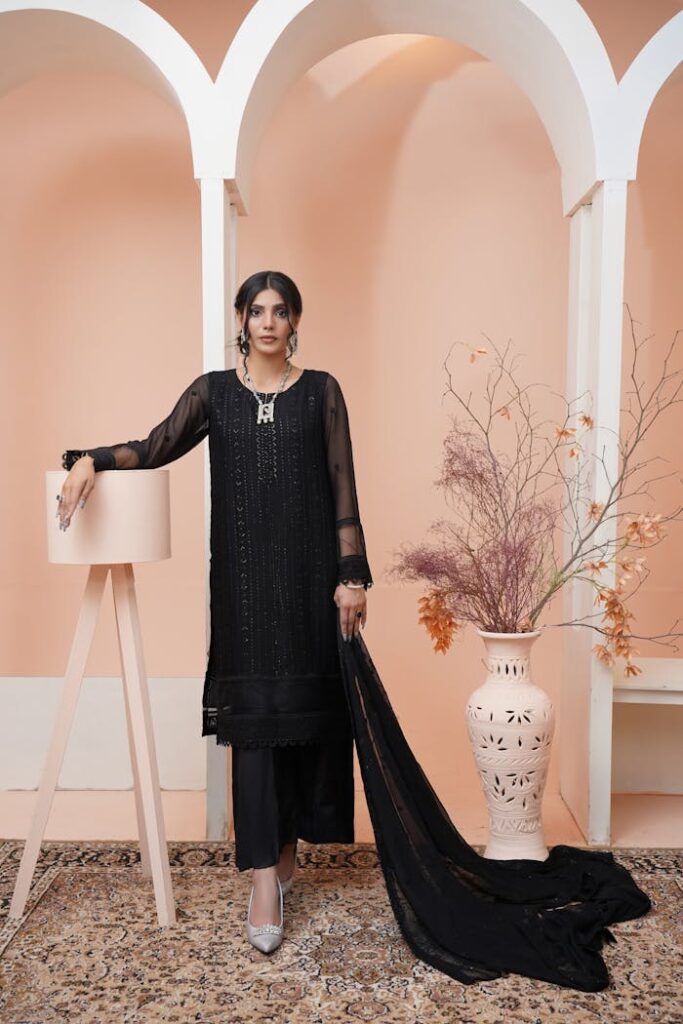 Elegant Woman in Black Traditional Clothing and Heels 