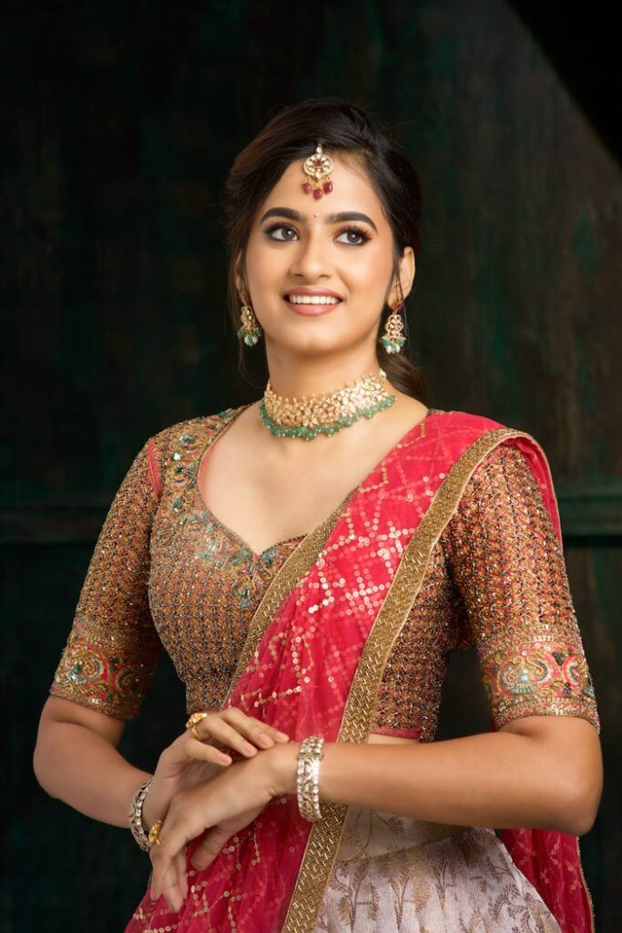 Portrait of Smiling Woman in Traditional Clothing , beautiful pink lehenga, pink golden lehenga with dupatta